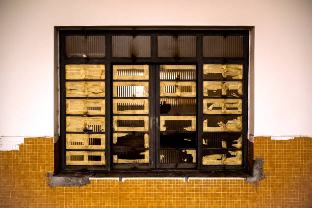 istock Old window of an abandoned school 1473021478
