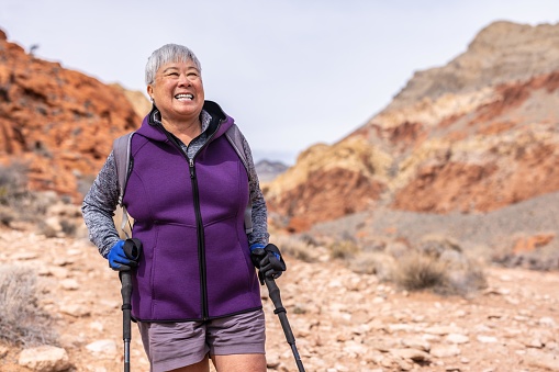 An asian Chinese American woman hiking in the Nevada desert