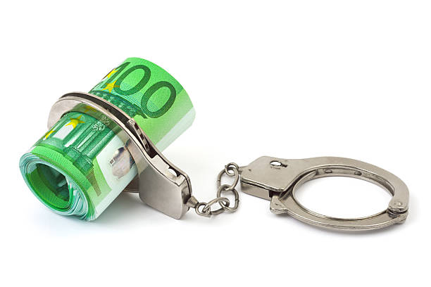istock Money and handcuffs 147302258