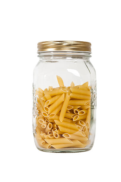 istock pasta in glass jar on a white background 147302287