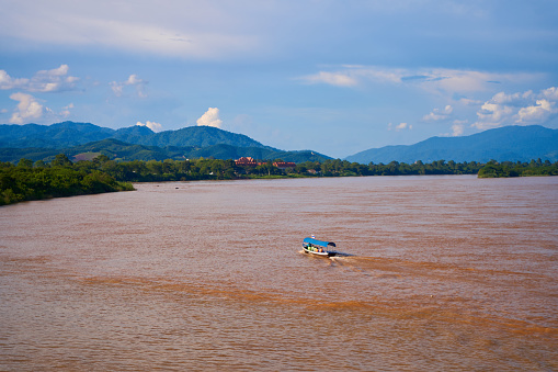 landscape of the Mekong River at the confluence of three countries, known as the Golden Triangle.