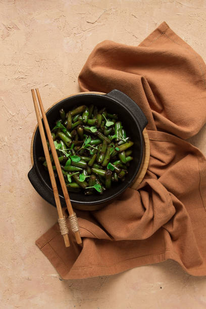 fried bean pods, in soy sauce, with sesame seeds, homemade, no people,