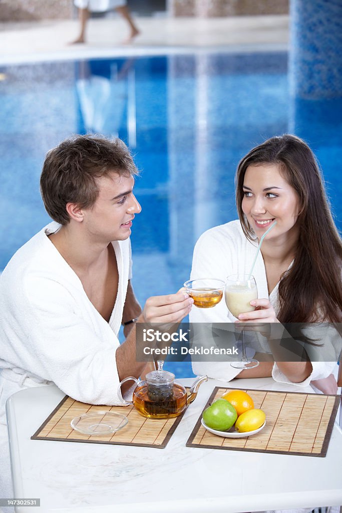 Flirtation The young man with tea and attractive girl in pool 20-29 Years Stock Photo