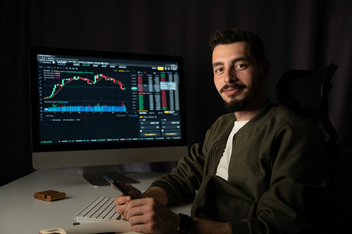 investor ,trader following stock market screen and cryptocurrency (digital money)