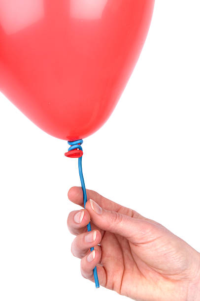 istock Woman's Hand Holding A Balloon 147302948
