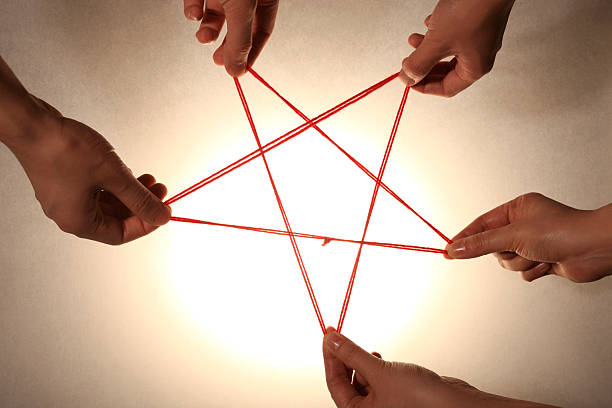 istock People playing cats cradle game,close-up 147303047