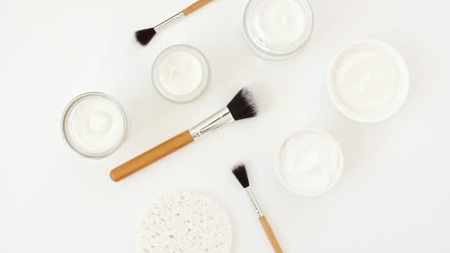 Makeup brushes. White cosmetic bottle containers. Natural skin care products . Zero waste, eco friendly and spa accessories. Beauty SPA branding mockup. No plastic.