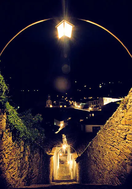 Nocturnal landscape with ancient stairway and urban lightstand in the historical town of Ouro Preto, Unesco World Heritage site, in Minas Gerais, Brazil. Photo taken with a Nikon FM2 camera and a Nikkor 24mm lens. Exposure unrecorded. Use of tripod. No flash. December, 1990.