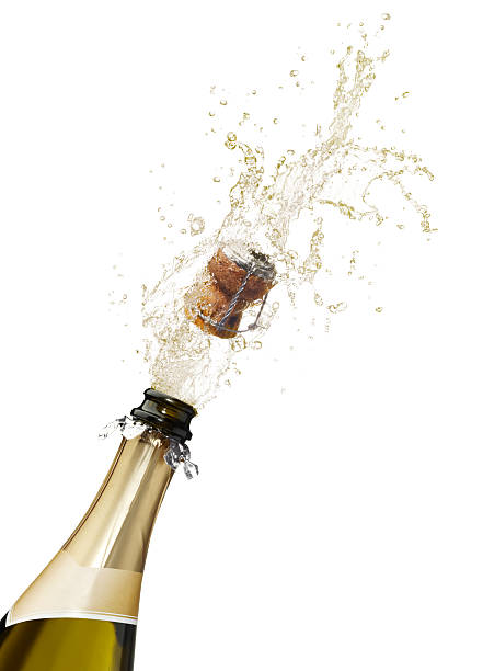 istock Champagne bottle popping its cork and splashing 147303189