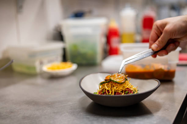 istock professional chef's hands cooking Raw beef meat tartar in restaurant kitchen 1473032101