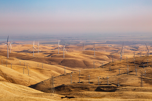 Wind turbines in the Californian countryside, on a hazy morning