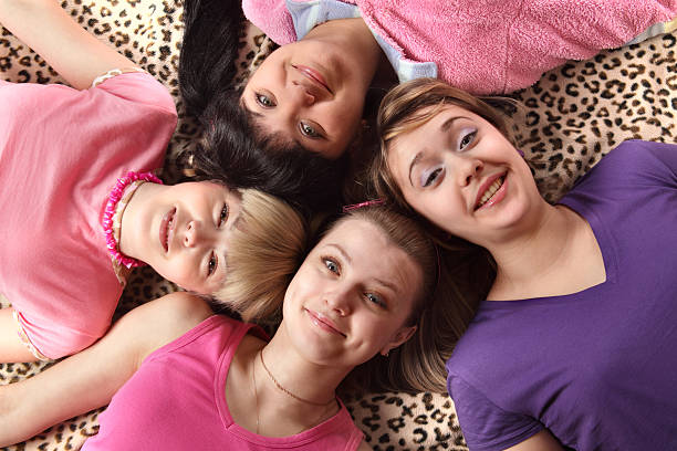 istock happy teen lying on floor 147303257