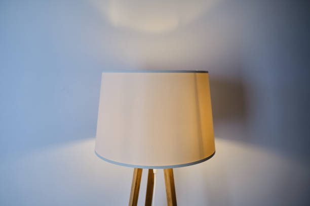 istock The included floor lamp close-up on a light background. Interior element. Place for text 1473033529