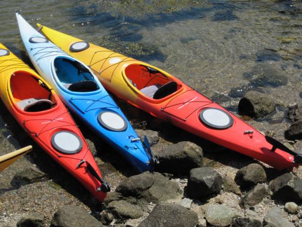 istock Colorful kayaks on rocky beach. 1473033624