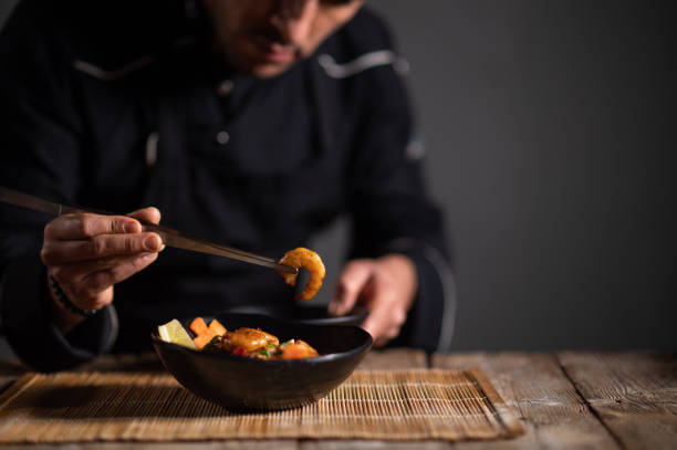 istock Male chef preparing a bowl of noodle 1473034855