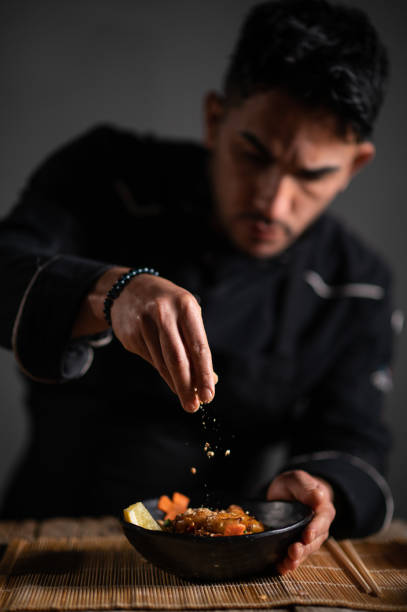 istock Male chef preparing a bowl of noodle 1473034932
