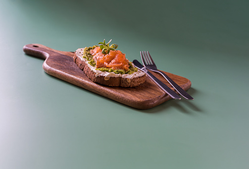 Studio photo of a healthy toast with cream and salmon ready-to-eat