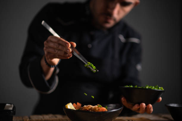 istock Male chef preparing a bowl of noodle 1473034946