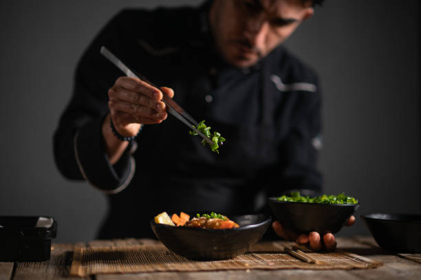 istock Male chef preparing a bowl of noodle 1473034955