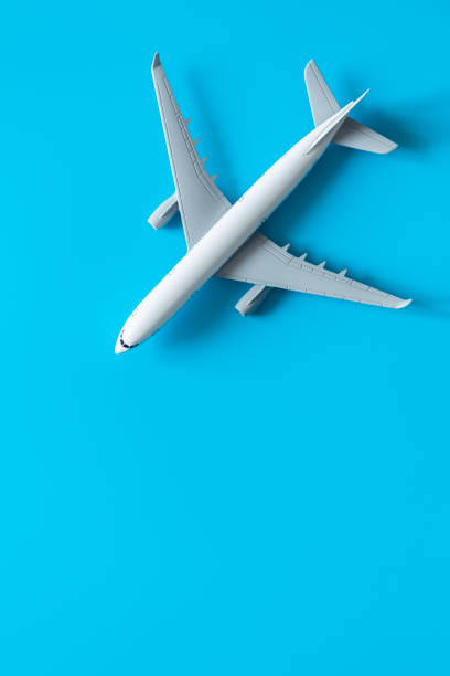 istock Airplane model on a blue background isolated, flat lay. 1473035891