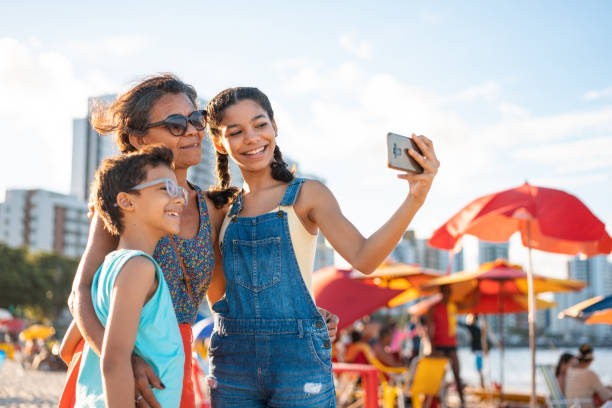 istock Family taking a selfie on the tropical beach 1473036173