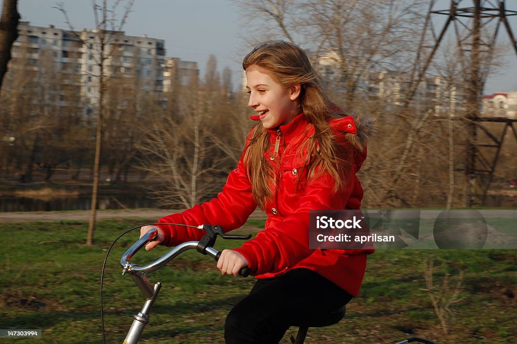 on bike happy pretty girl on bike 12-13 Years Stock Photo