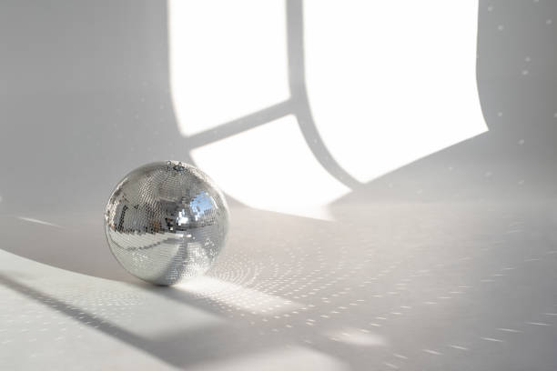 istock A mirror ball with sunbeams on a photo studio cyclorama 1473040019