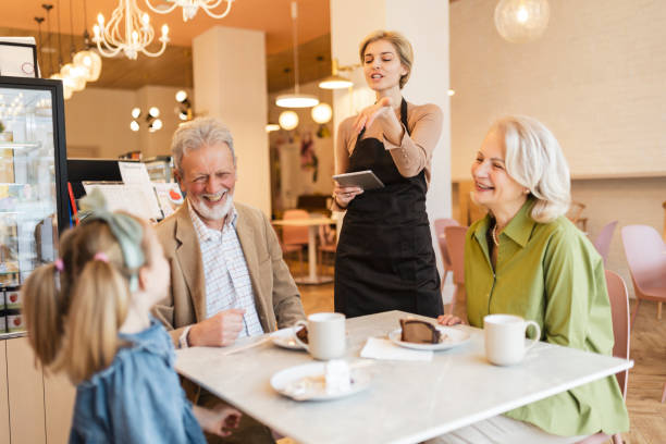 istock Grandparent spending time with granddaughter at cafe 1473040622