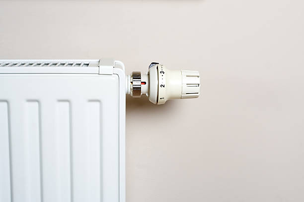 istock Radiator with thermostat on wall 147304085