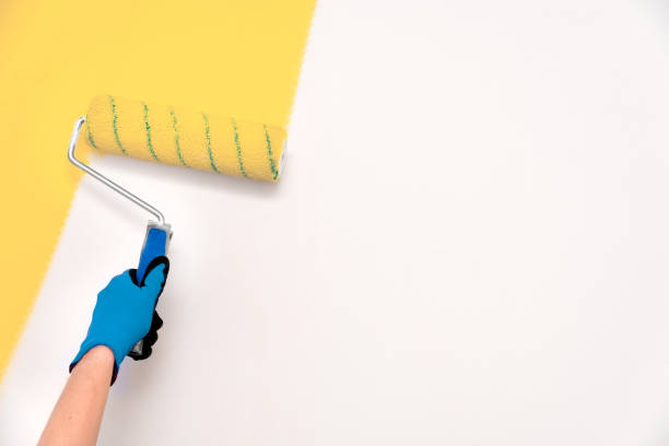 istock Close up of painter, roller painting 1473041588
