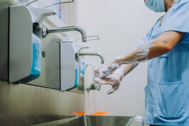 istock Unrecognizable doctor washing hands before operating 1473043726