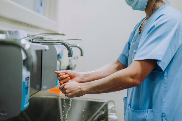 istock Unrecognizable doctor washing hands before operating 1473044022