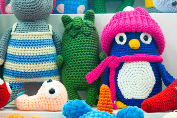 istock Knitted multi-colored toys in the form of various animals. 1473046573