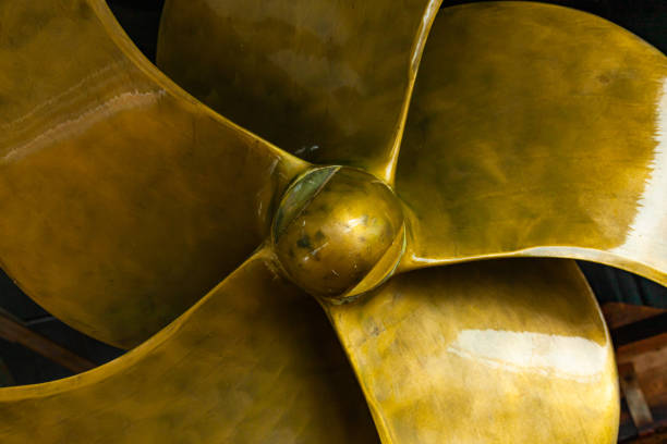 New ship's seven-blade bronze propeller, close-up. New ship's seven-blade bronze propeller, close-up. thrust stock pictures, royalty-free photos & images