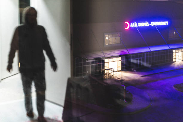 istock Human silhouette walking towards emergency room entrance 1473048486