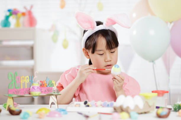 istock young girl was making Easter craft and decorations at home 1473050880