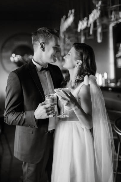 istock bride and groom inside a cocktail bar 1473054062