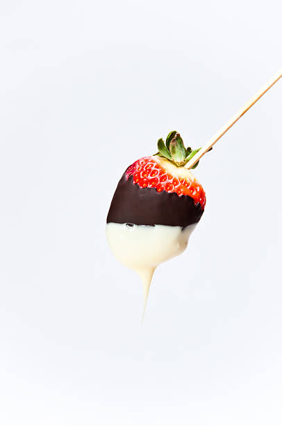 istock Dark and white chocolate coated strawberry on a stick 147305499