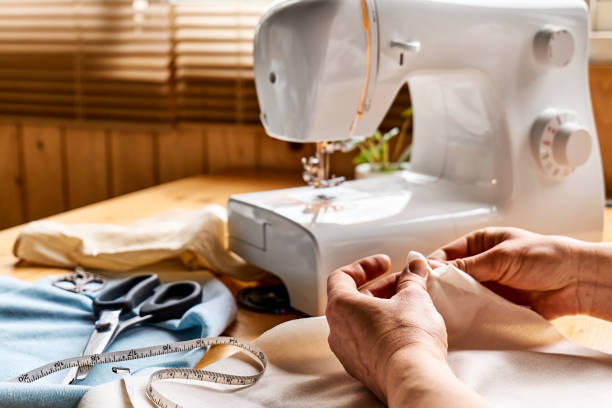 istock Seamstress basting and sewing in a small studio. Sartorial clothes. Fashion studio, tailoring, handmade clothing concept. Slow fashion. Conscious consumption. 1473059628