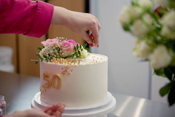 istock Confectioner decorates a birthday cake 1473060368