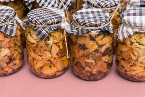 istock Glass jars with different types of canned mushrooms 1473061030