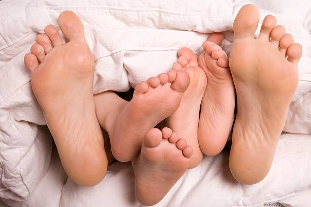 istock Womans feet and kids feet 147306187