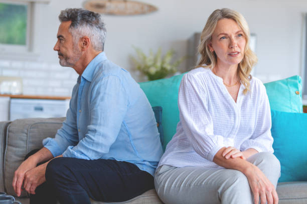 istock Mature couple fighting at home sitting on the sofa. 1473061932