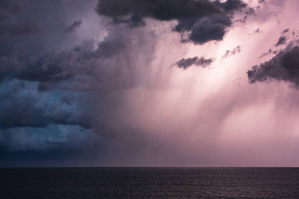 istock Extreme storm over the ocean with heavy rain, lightning and dark dramatic clouds 1473062127