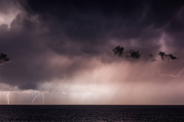 istock Tornado waterspout in the ocean with heavy rain, lightning and dark dramatic sky, clouds 1473062164
