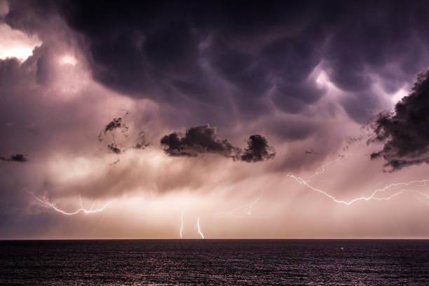istock Extreme storm over the ocean with rain, lightning and dark dramatic sky, clouds 1473062168