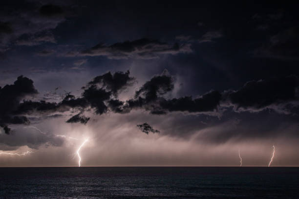 istock Extreme storm over the ocean with rain, lightning and dark dramatic sky, clouds 1473062188