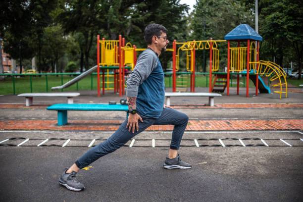 istock Mature man stretching outdoors 1473062344