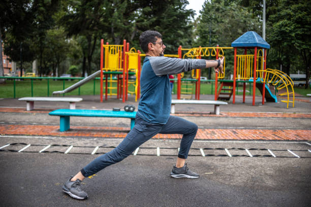 istock Mature man stretching outdoors 1473062346
