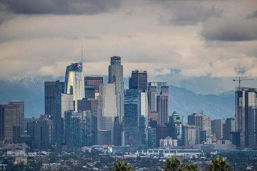 Los Angeles, CA USA - March 1, 2023 - Multiple storms drop low level snow to San Gabriel Mountains, blanketing Los Angeles in a winter wonderland background.